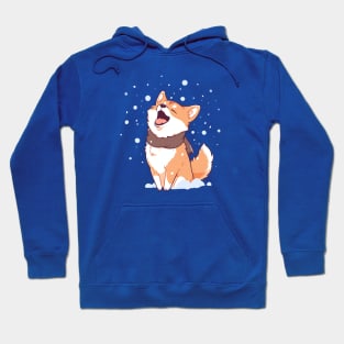 A shiba dog trying to eat the falling snowflakes Hoodie
